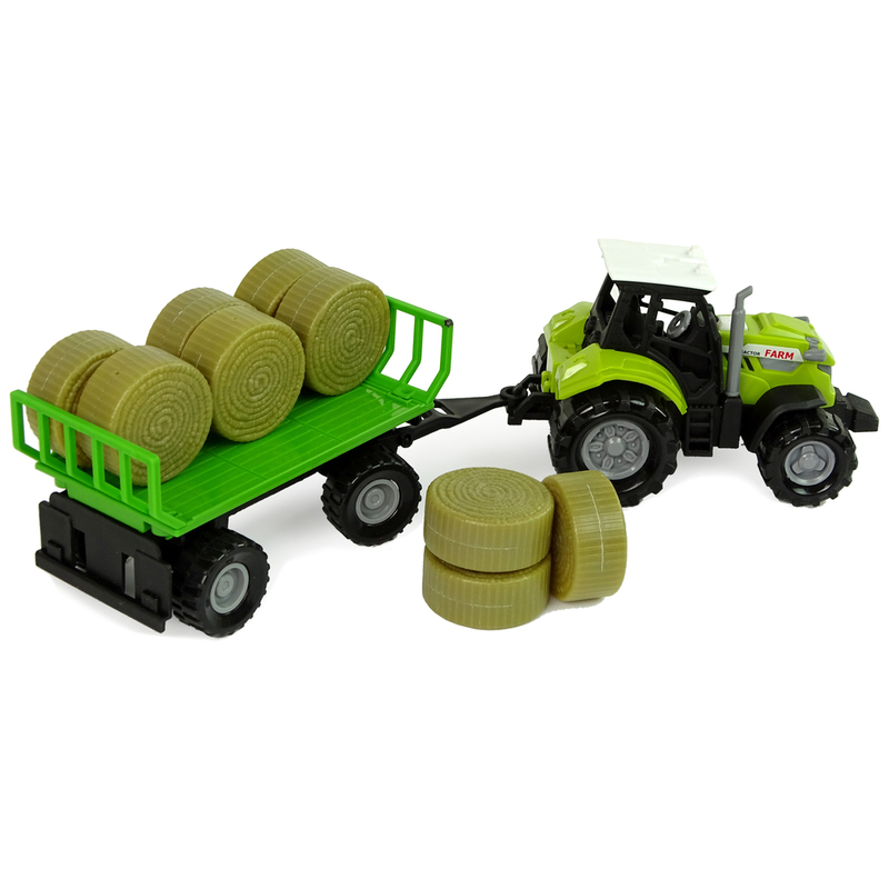 Traktor koos haagise ja heinapallidega