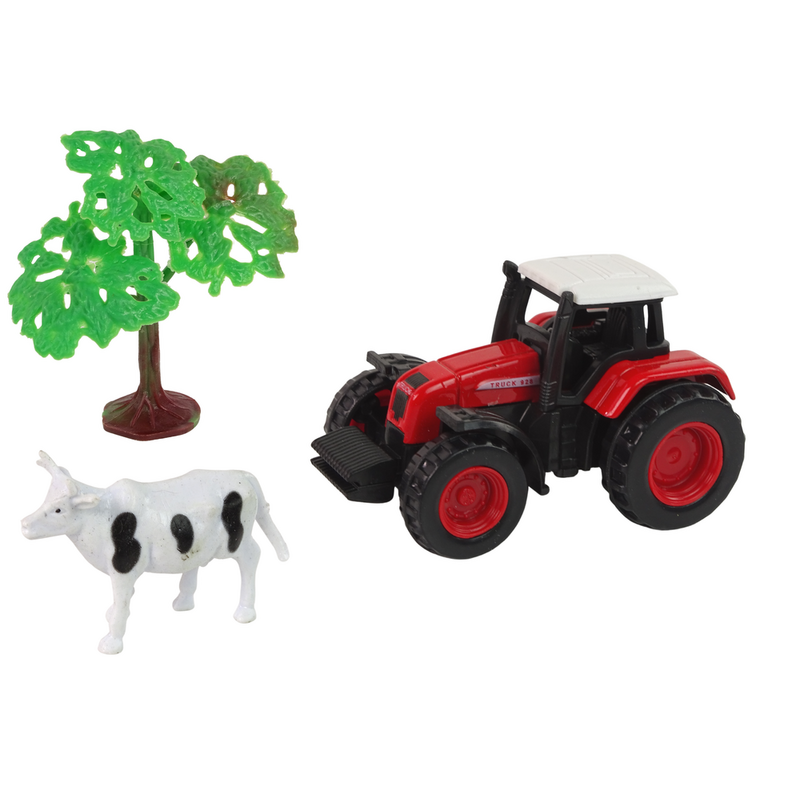 Traktor koos haagisega ja lehmaga