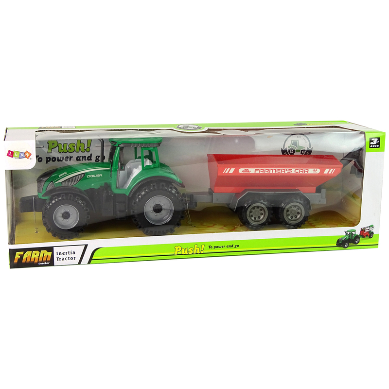 Roheline traktor punase haagisega