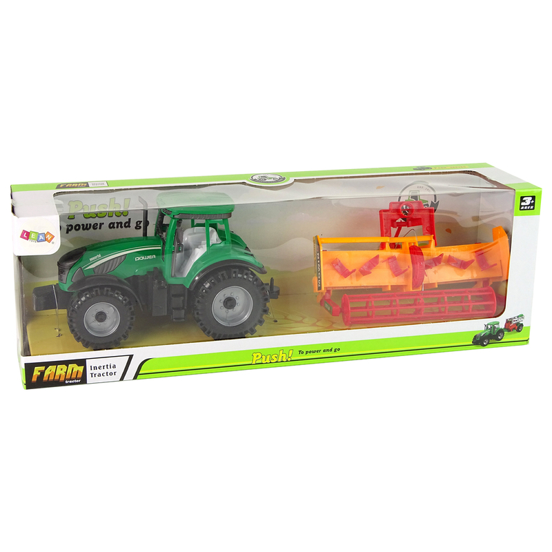 Roheline traktor koos oranži kultivaatoriga